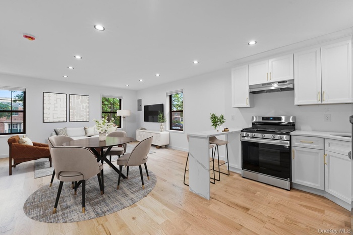 Dining room featuring recessed lighting and light wood-style floors