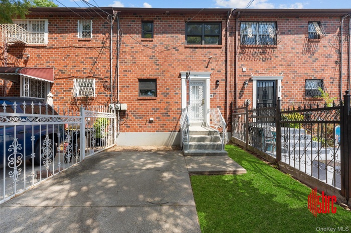 View of front of house with brick siding