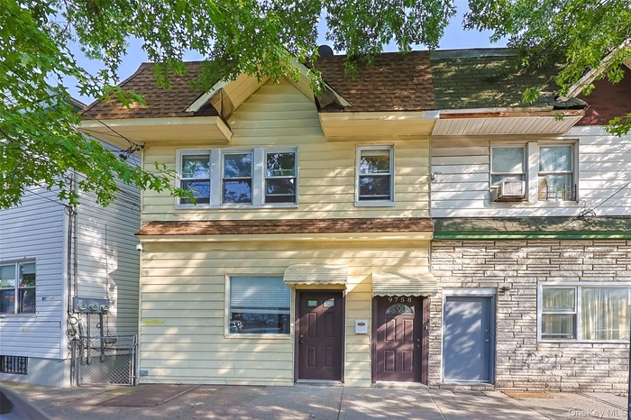 View of front facade with roof with shingles