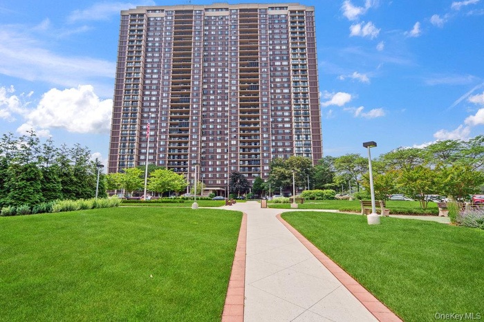 View of home's community featuring a yard