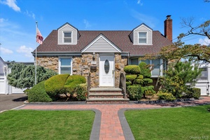 Welcome to this charming Cape in the heart of East Meadow.