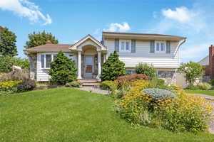 Beautiful Split Level situated on quiet mid block in West Farmingdale, great curb appeal w fieldstone amp ; vinyl exterior, vinyl soffits, new leaders, gutter amp ; window shutters, double ...