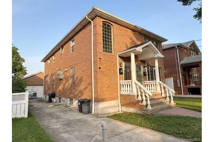 View of front of property featuring brick siding