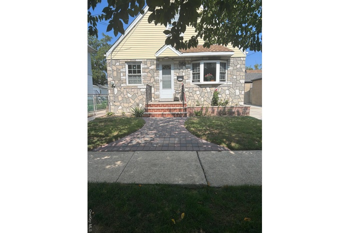 View of front of home featuring stone siding