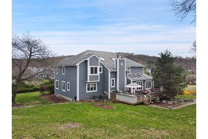 Welcome to 13 Cross Road, a beautifully maintained 4 bedroom, 3 bath contemporary home, ideally located in the desirable Old Brook Farms neighborhood.