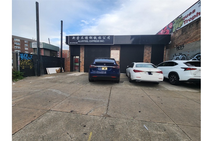 View of property with uncovered parking