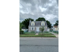 Welcome to 118 Allen Street in Hempstead, NY A classic Cape Cod style home brimming with character, charm, and renovation potential.