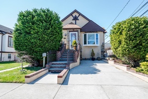 Westholme Updated Legal 2 Family, Living Room, Dining Room, Large Kitchen, 4 Bedrooms, 3 Full Baths, Cathedral Ceilings, Hi Hats, Solar Panels, Central Air Conditioning Ductless Air Conditioning, Granite Counters, ...
