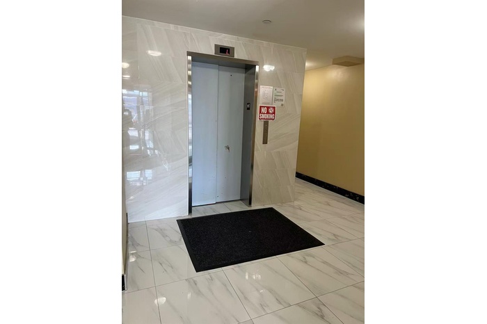 Common area with tile walls