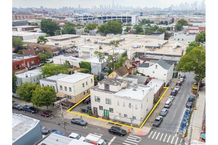 Aerial view of lot with city skyline