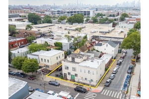 Rare Queens corner lot with significant air rights potential, existing mixed use buildings, and value add or ground up development options.