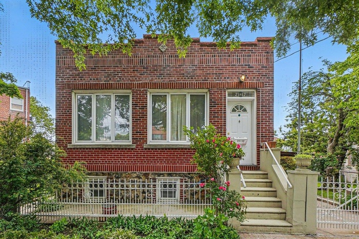 View of front of home featuring brick siding