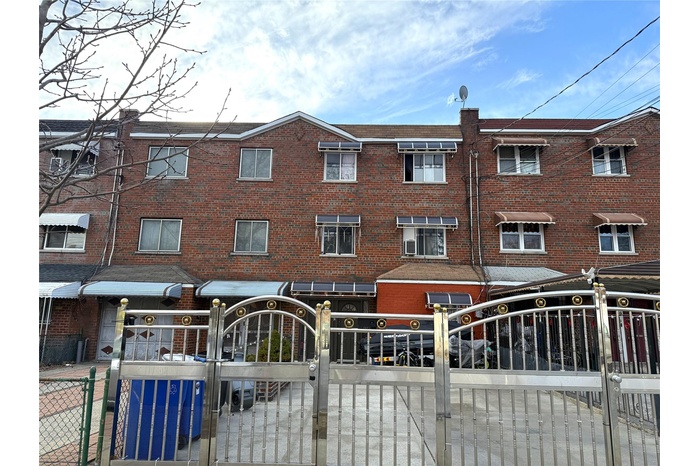 View of property featuring a fenced front yard