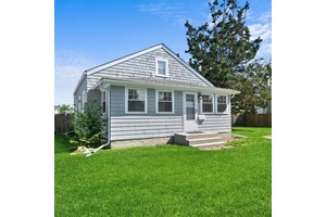 Welcome to this charming Cape Cod style home that lives like a ranch, with all rooms conveniently located on the main level.