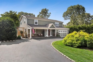 Set on 1. 7 acres comprising two separate lots, this beautiful 5 bedroom, 3.