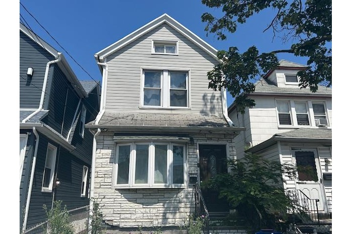 View of front of property with stone siding