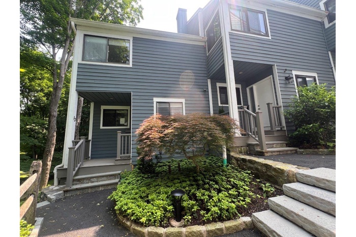 View of front of property with a chimney