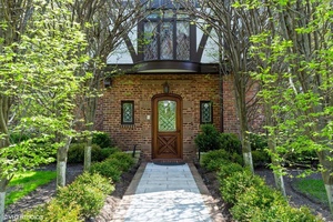 Palatial and exquisitely appointed, this stunning tudor colonial showcases, architectural moldings, a grand entryway, soaring ceilings, and a sweeping staircase, This home features an elegant formal living room, a banquet ...