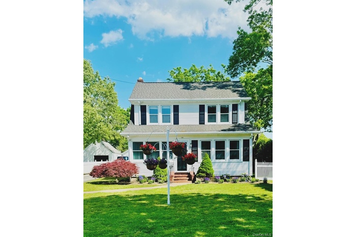 View of front of home featuring a shingled roof