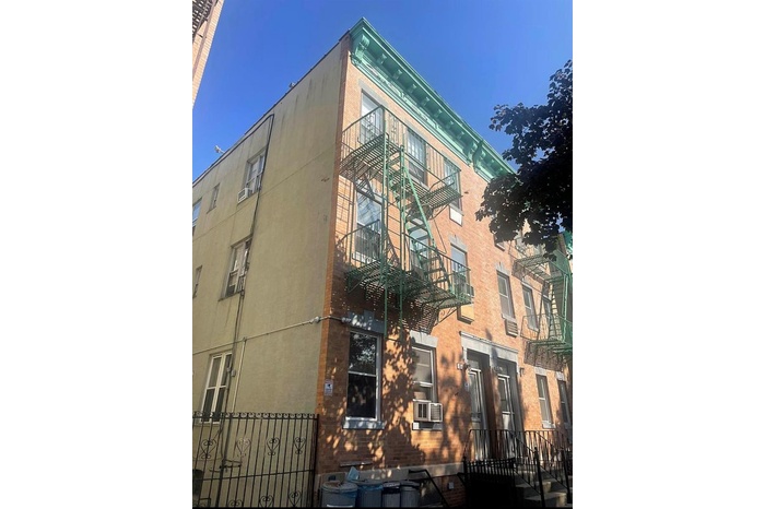 View of apartment building / complex with cooling unit