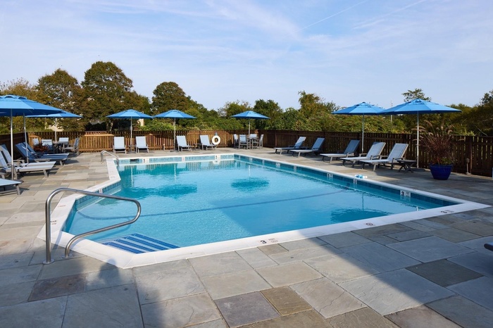 Community pool with a patio area