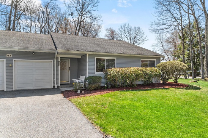 The super curb appeal of thisi condo with driveway and walkway no steps to front door.