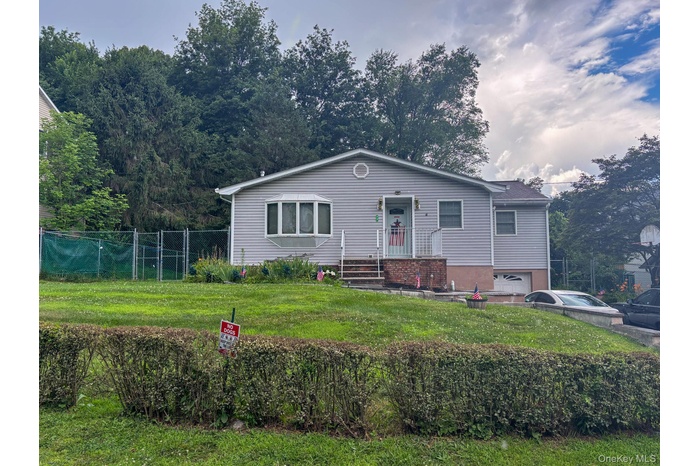 View of front of property featuring an attached garage