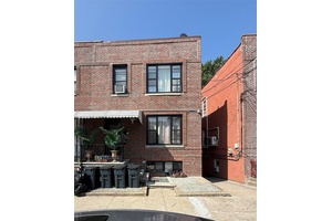 Extra large brick legal three family located in the heart of Morris Park !