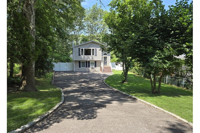 View of front of house featuring driveway