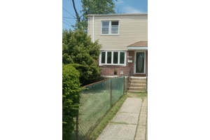 Ready for its New Owner. This corner property is Freshly painted with beautiful hardwood floors and a fully finished basement.