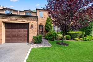Welcome to 95 Windsor Gate Drive, a newly updated, south facing, lake front condo located at The Gates in New Hyde Park.