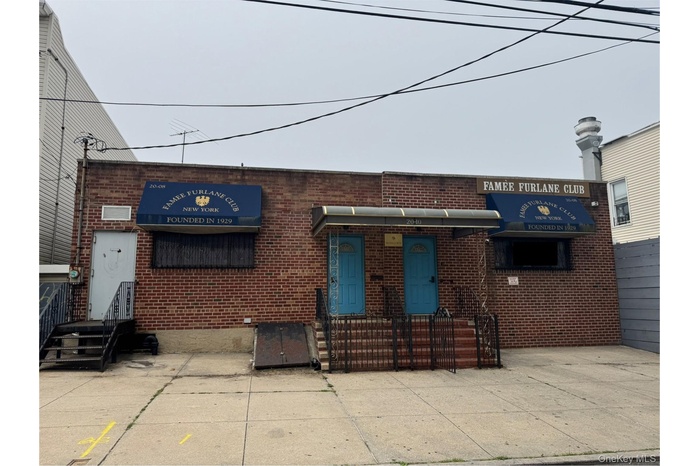 View of building exterior with entry steps
