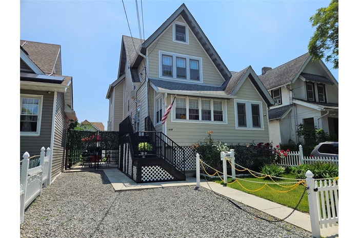 View of front of property featuring a shingled roof