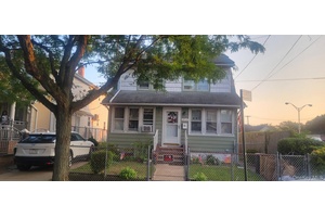 Bright and sunny, large three bedroom Colonial with2 and 1 2 baths.