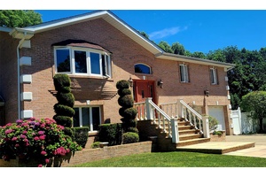 A must see. Magnificent, contemporary all brick home on a quiet cul de sac in pristine condition.