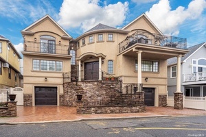 Luxurious Living By The Beach in this Uniquely Custom Built Mediterranean Style Home.