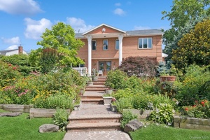 Stately 7 Bedroom, 7 Bath Brick Estate with Gorgeous unobstructed Water Views in Prime Woodsburgh Location.