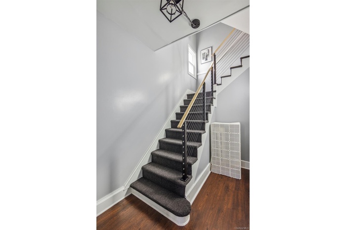 Stairway with wood -like LVP floors and baseboards