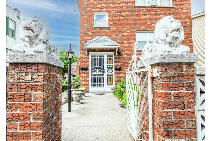 Property entrance featuring brick siding