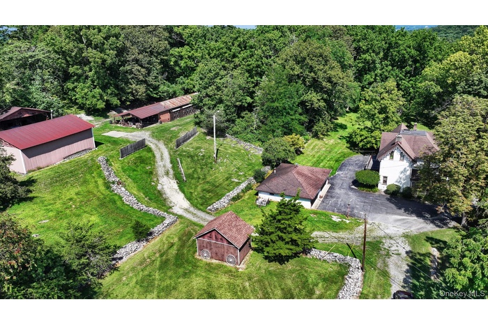 View of subject property featuring a forest