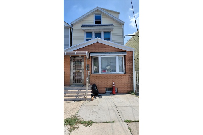 View of front of house featuring brick siding