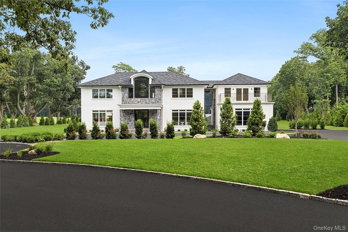 Grand approach with semi circular driveway, professionally landscaped