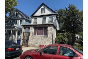 This Legal 2 Family home sits on a spacious lot of 55x100.