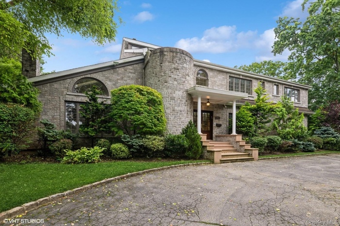 Front of property featuring a chimney