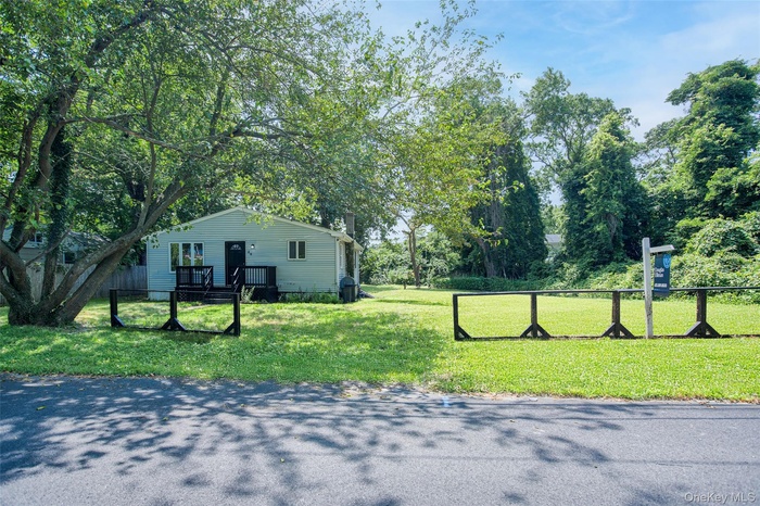View of home's exterior featuring view of scattered trees