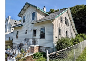 An exciting opportunity to live in a beautifully arranged mother daughter apartment that offers incredible options for creative living.