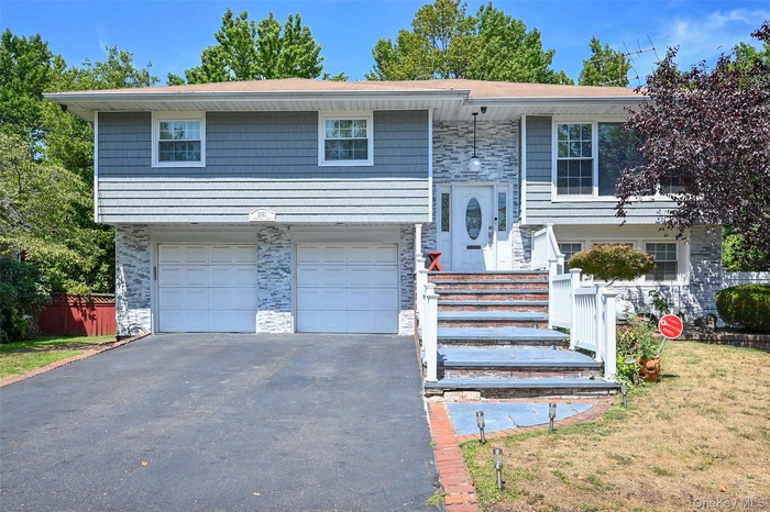Featuring an attached garage and private driveway