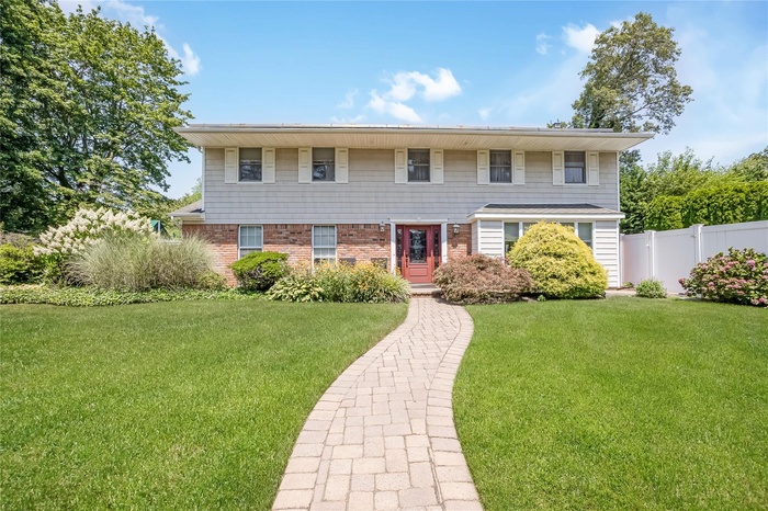 View of front of home featuring brick siding