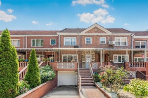 Beautiful recently renovated attached colonial extended home in the heart of Rego Park.