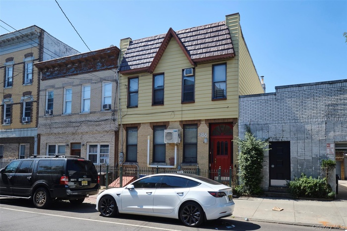 View of front of house featuring brick siding